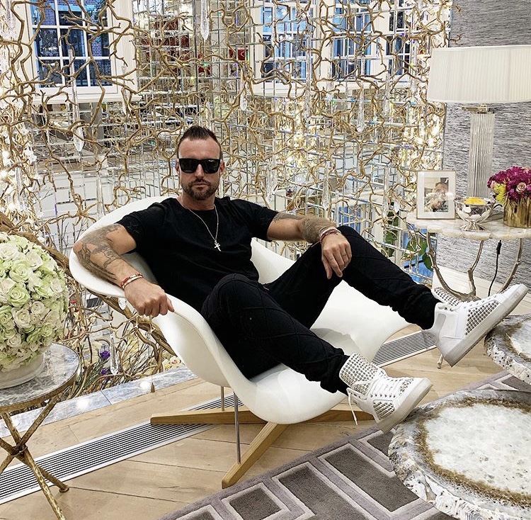 Ferrari Threatens To Sue Philipp Plein After Instagramming His Shoes On Top Of His Ferrari