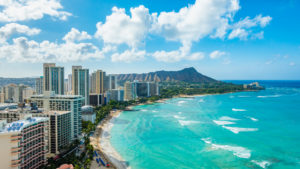 Waikiki Beach and Diamond Head Crater including the hotels and buildings in Waikiki, Honolulu, Oahu island, Hawaii. Waikiki Beach in the center of Honolulu has the largest number of visitors in Hawaii - Baller Alert