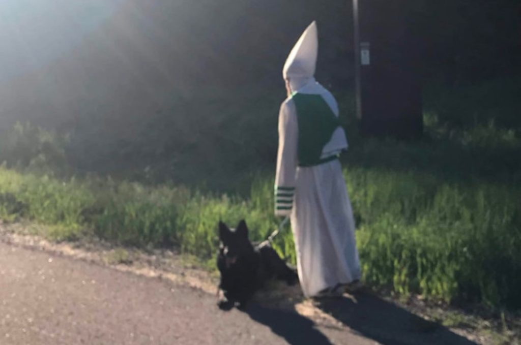 Man in KKK outfit
