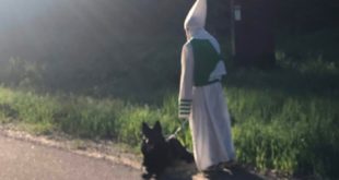 Man in KKK outfit