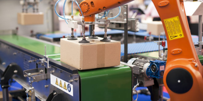 Packaging line with robotic arm at work