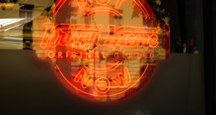 Krispy Kreme Sign With Building Reflection