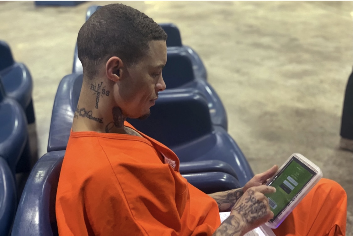 314877C4-2E8D-44D6-88E7-539D98C86DBB - Baller Alert Inmate with Tablet pic from AP