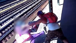 Man pushes woman onto train tracks in the Bronx. 