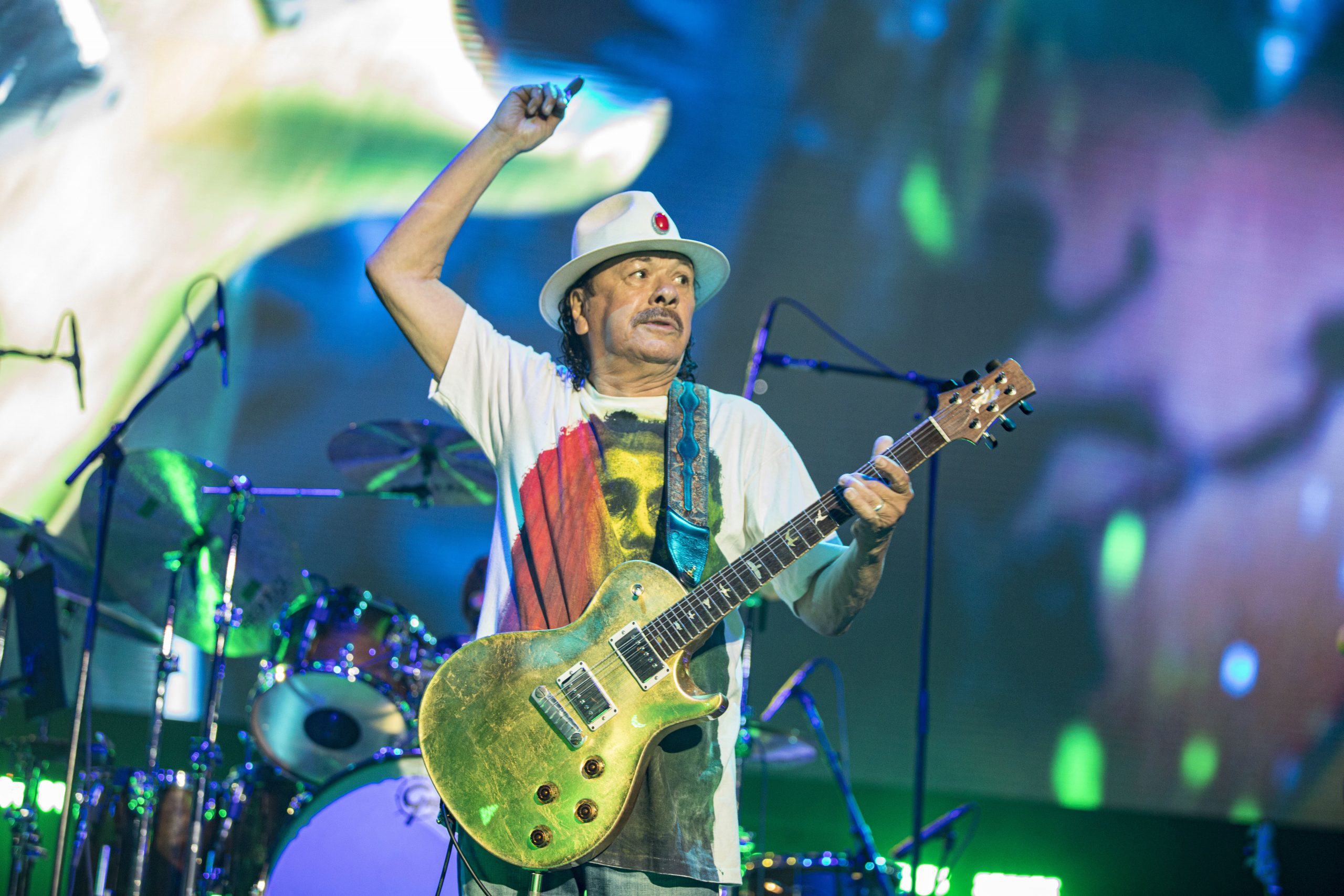 Social Media Drags Carlos Santana For Transphobic Concert Speech: "A Woman Is A Woman And A Man Is A Man"