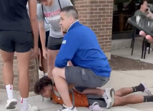 Chicago Police Sgt. Michael Vitellaro kneeling on child. - Baller Alert Chicago Police Sgt. Michael Vitellaro kneeling on child.