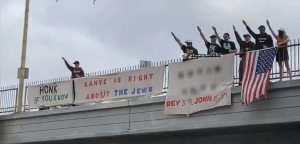 Group of people/neo-Nazis throwing up Nazi salute.
