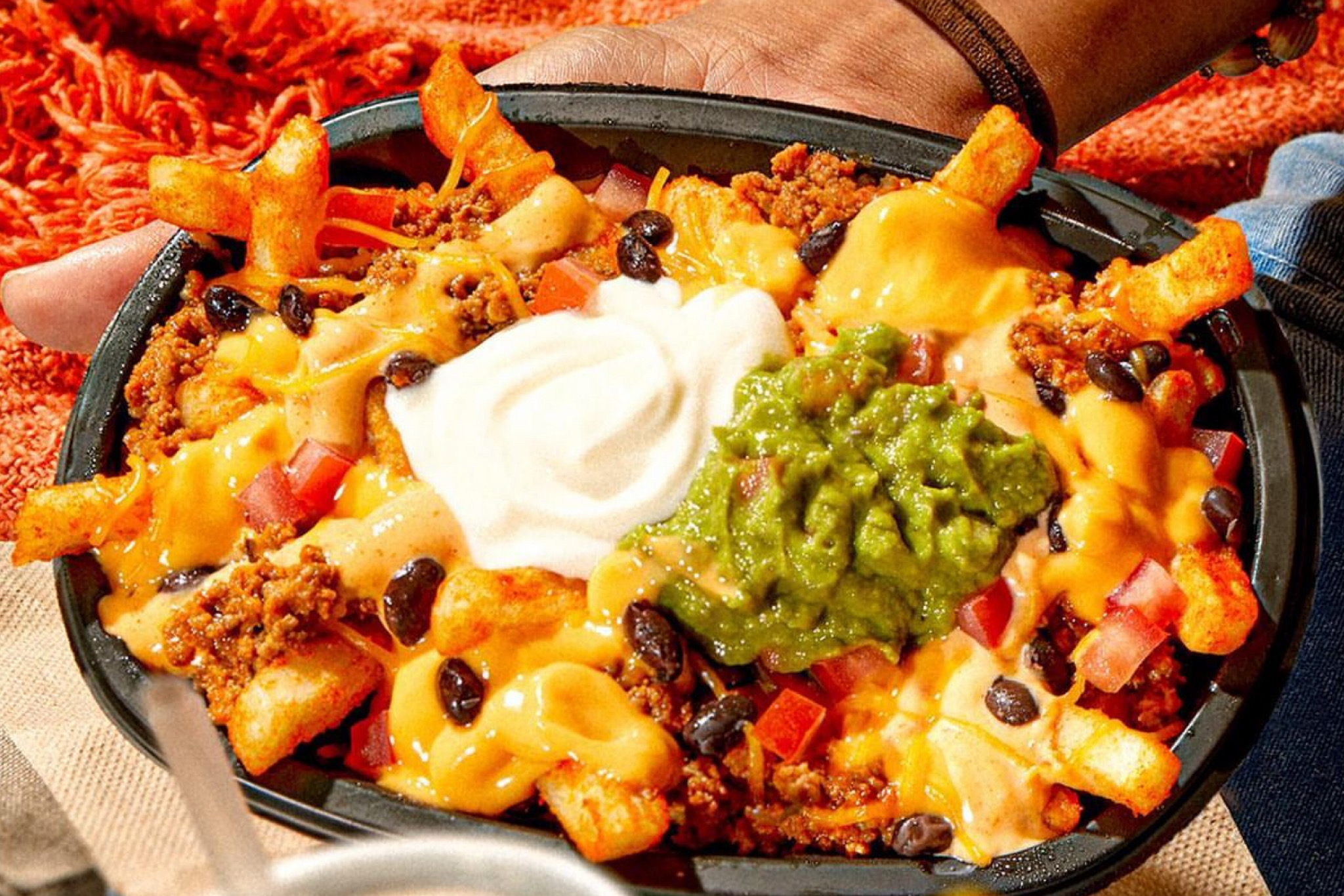 Taco Bell Reveals New 7 Layer Nacho Fries While Also Bringing Back Fan