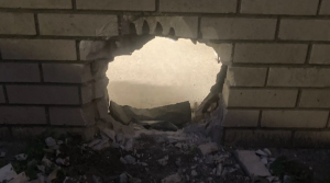 The hole made in a jail wall by the two inmates who escaped