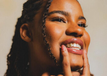 Ballerific Fashion: New York Liberty's Nyara Sabally Shows Off Her 14K Gold Olympic-Themed Grill