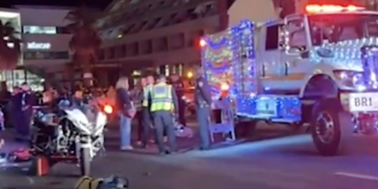 10 People Injured After Police Officer Allegedly Popping a Wheelie Plowed Into Parade-Goers