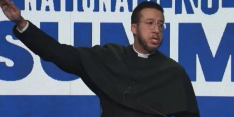 Michigan Priest Loses License After Controversial Gesture at Conservative Event [Video]