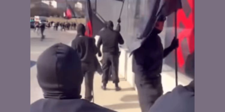 Cincinnati Residents Confront Hate Group Displaying Swastikas on Overpass [Video]