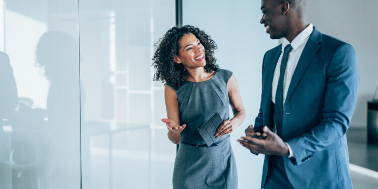 Business people in the office - Baller Alert Office Romance or Corporate Chaos? Why Dating a Coworker Can Go From Cute to Catastrophic