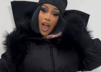 Cardi B poses in an all-black outfit as she announces her comeback season on Instagram.