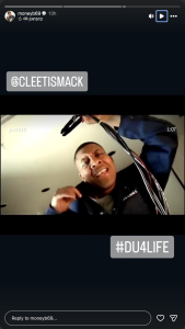 - Baller Alert Smiling man in a blue jacket surrounded by tangled cables, camera angled from below; video still with '1:07' timestamp and '#DU4LIFE' tag.