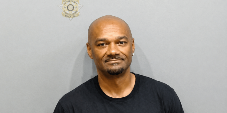Big Tigger’s Mugshot Goes Viral As Warrants Reveal Alleged Bedroom Fight Over Female Co-Worker Texts