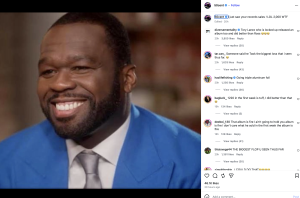 Close-up of a smiling Black man wearing a bright blue suit and gray tie.