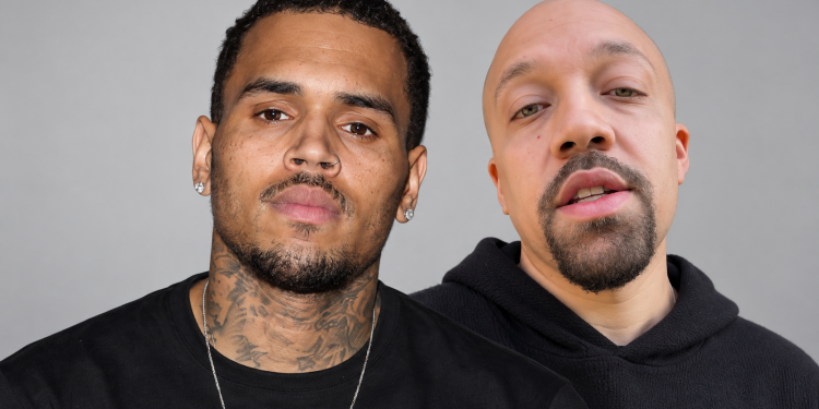 Two men posing for a close-up portrait: on the left, a tattooed man with a nose ring and earrings; on the right, a bald man with a goatee wearing a black hoodie.