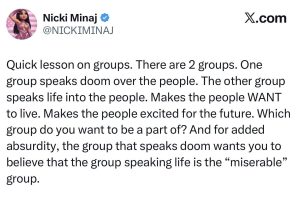 Screenshot of Nicki Minaj's verified X post. The text reads: 'Quick lesson on groups. There are 2 groups. One group speaks doom over the people. The other group speaks life into the people... Which group do you want to be a part of? ... the group that speaks doom wants you to believe that the group speaking life is the “miserable” group.'