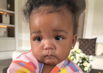 Rihanna holding her daughter Rocki