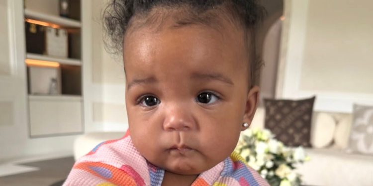 Rihanna holding her daughter Rocki
