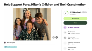 - Baller Alert Group portrait of a grandmother with three children smiling for a family photo on a fundraising page.