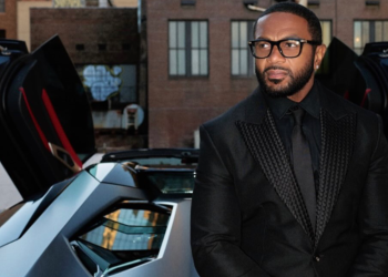 Ant Wilson poses with his Lamborghini and Georgia vanity plate