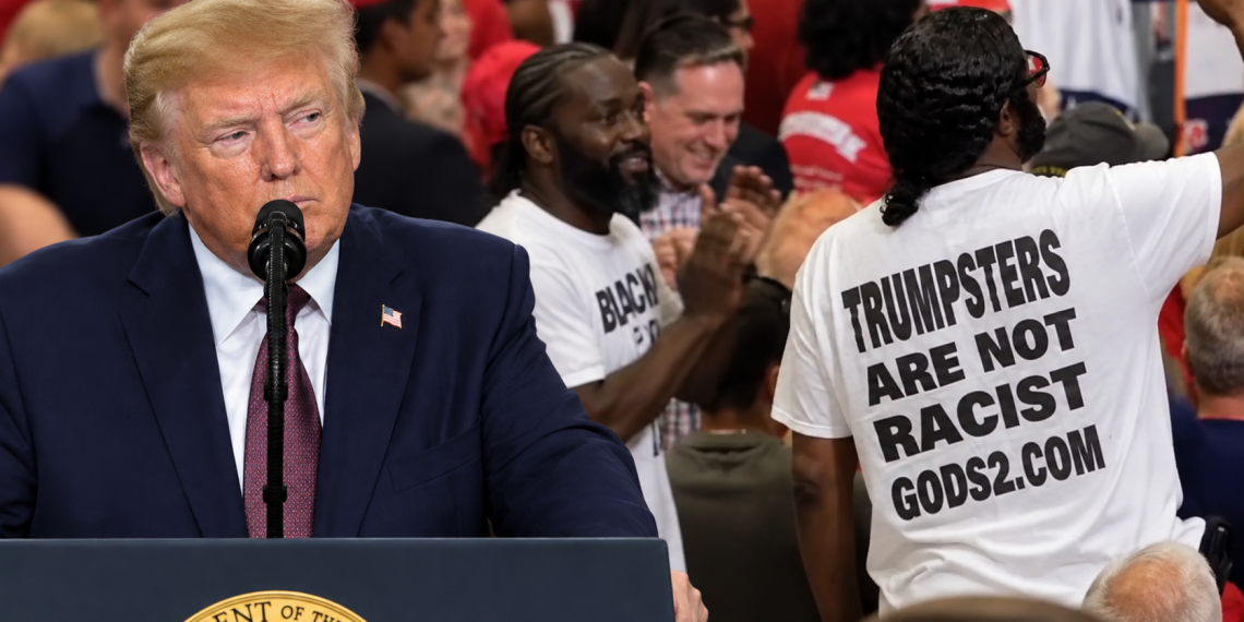 Blacks for Trump supporters stand as Trump speaks at his Chillicothe, Ohio rally
