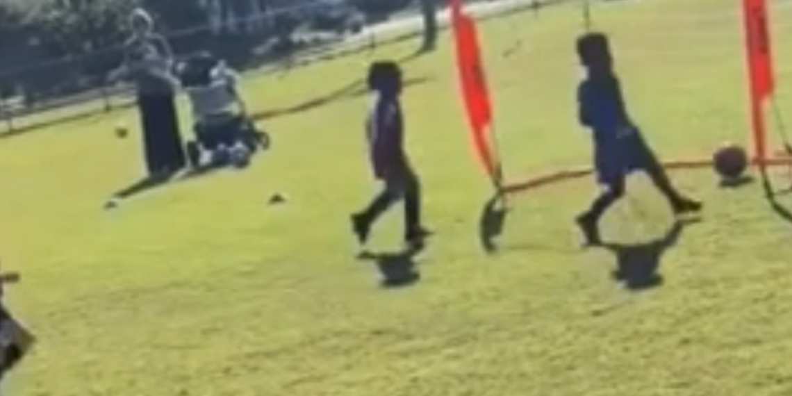 3 year old soccer player Nevada dribbling on a youth field in Winter Park, Florida