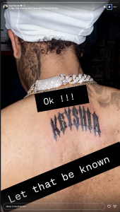 Person shown from behind with a jagged black neck tattoo, wearing a jeweled diamond chain and a white head wrap; black caption overlays read 'Ok!!!' and 'let that be known'.