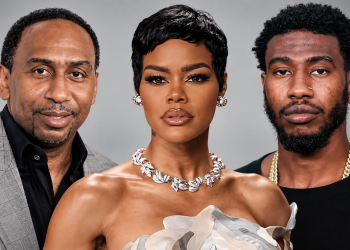 Group portrait of three adults: left man in a gray plaid blazer, center woman with short black hair and diamond necklace, right man with a gold chain.
