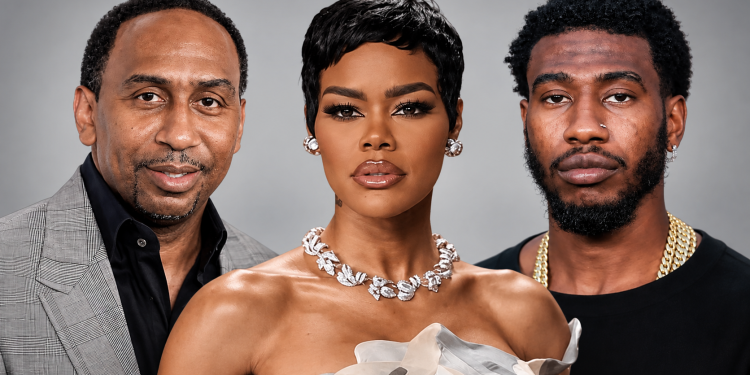 Stephen A. Smith, Teyana Taylor and Iman Shumpert - Baller Alert Group portrait of three adults: left man in a gray plaid blazer, center woman with short black hair and diamond necklace, right man with a gold chain.