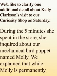 Text on a beige gradient background stating that Kelly Clarkson visited the Curiosity Shop and asked about a mechanical bird puppet named Molly.